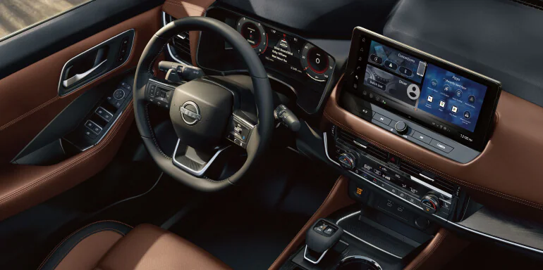 Interior of a 2026 Nissan Rogue featuring a modern dashboard, touchscreen display, and driver-focused controls